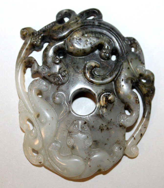 A CHINESE JADE-LIKE GROUP OF TWO CONFRONTING CHILONG, (1 of 2)