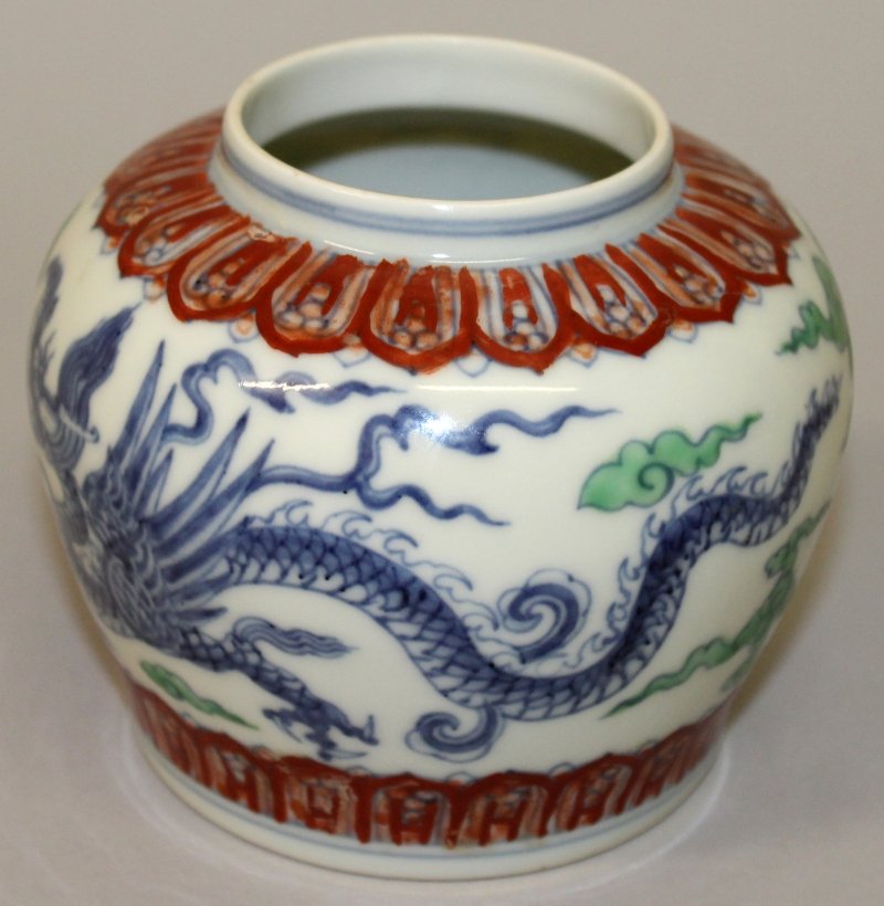 A CHINESE DOUCAI PORCELAIN DRAGON JAR, decorated with (1 of 7)