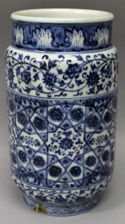 A CHINESE MING STYLE BLUE & WHITE PORCELAIN VASE, the: A CHINESE MING STYLE BLUE & WHITE PORCELAIN VASE, the sides of the cylindrical body decorated with formal patterns and borders, 9.8in high.