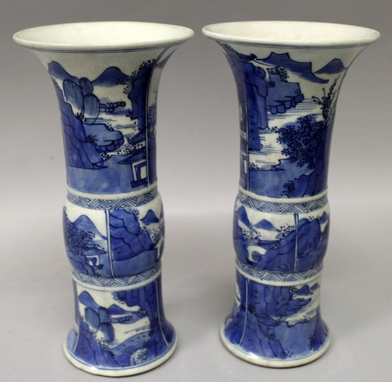 A PAIR OF CHINESE BLUE & WHITE PORCELAIN GU VASES, each: A PAIR OF CHINESE BLUE & WHITE PORCELAIN GU VASES, each decorated with a variety of river landscape panels, 8.5in high.