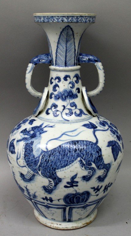 A CHINESE MING STYLE BLUE & WHITE PORCELAIN VASE,: A CHINESE MING STYLE BLUE & WHITE PORCELAIN VASE, decorated with kylin, the neck with animal head and moulded ring handles, 13.2in high.