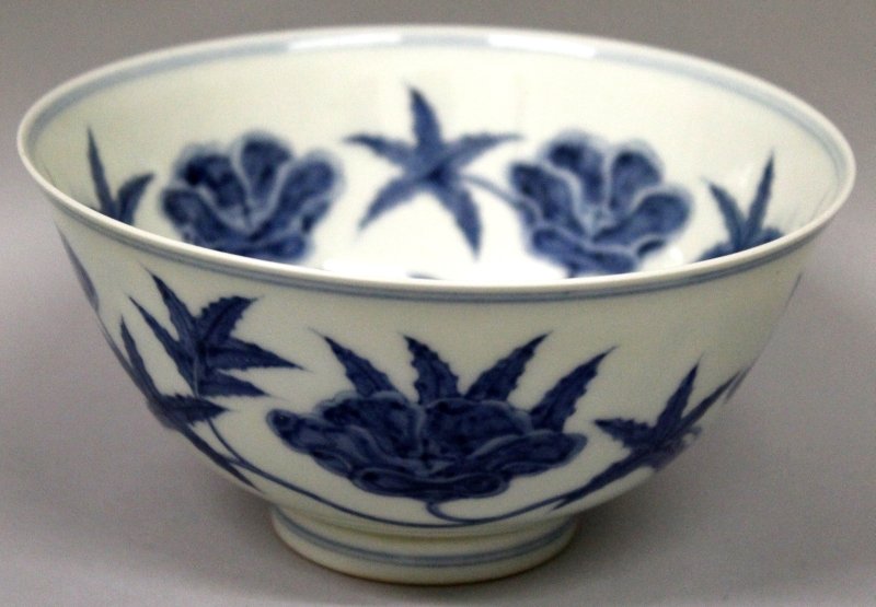 A GOOD QUALITY CHINESE BLUE & WHITE PORCELAIN BOWL, the: A GOOD QUALITY CHINESE BLUE & WHITE PORCELAIN BOWL, the interior and exterior sides decorated with formal meandering foliage, the base with a six-character Chenghua mark, 5.7in diameter & 2.9in high.