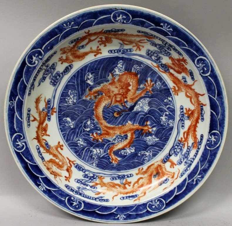 A CHINESE UNDERGLAZE-BLUE & IRON-RED PORCELAIN DRAGON (1 of 5)