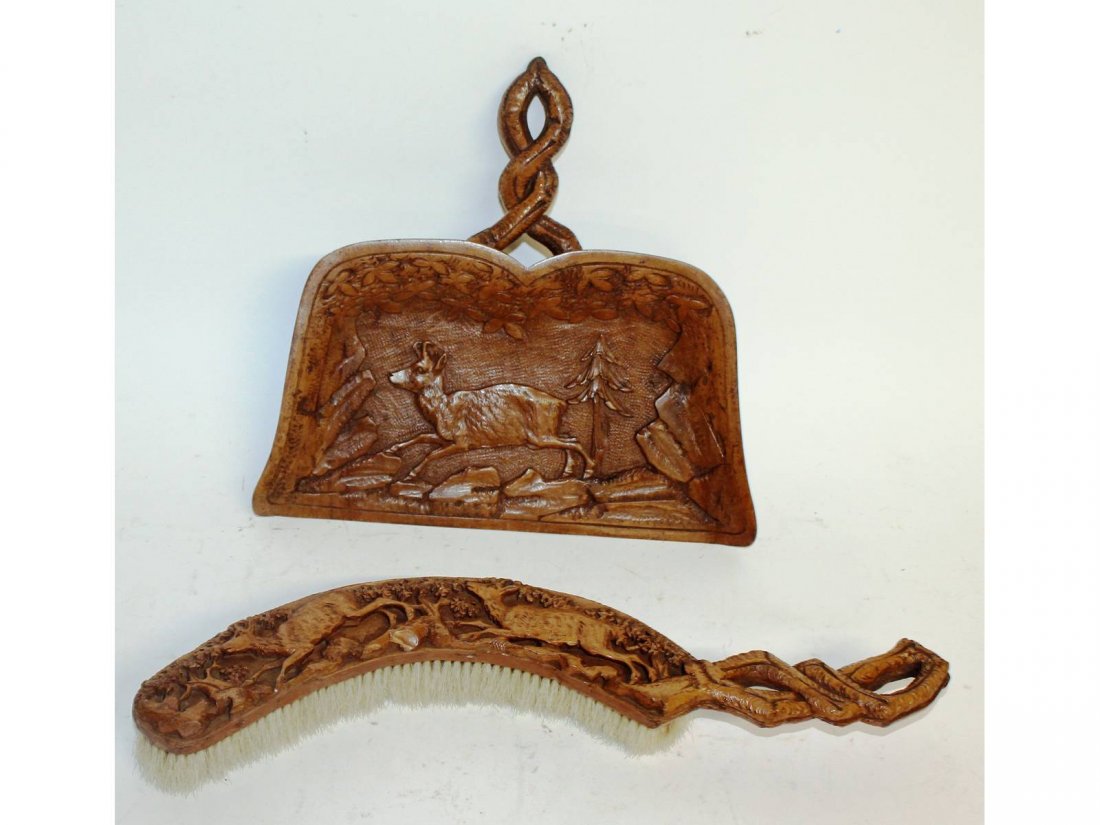 A carved Black Forest crumb scoop and brush.: A carved Black Forest crumb scoop and brush.