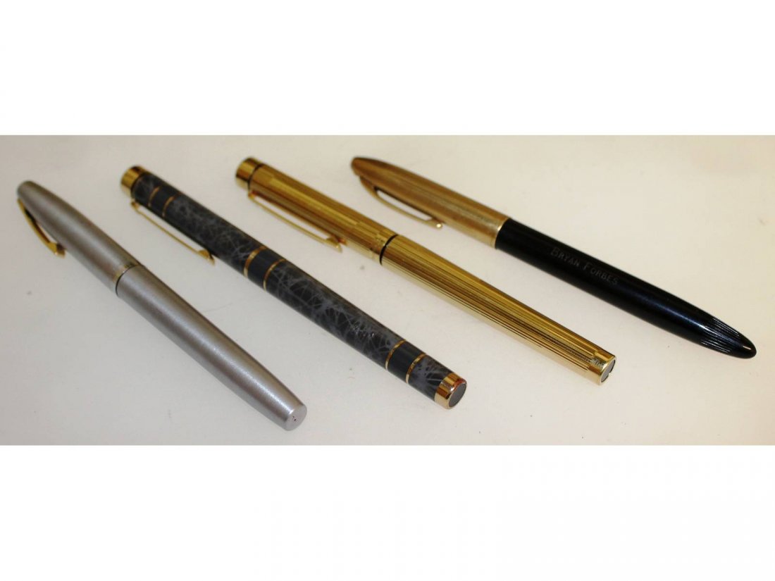Four good Sheaffer fountain pens, a gold-plated Targa: Four good Sheaffer fountain pens, a gold-plated Targa fitted with a rare broad nib, a stainless steel Triumph with fine nib, a Valiant Snorkel with broad nib, and one other.