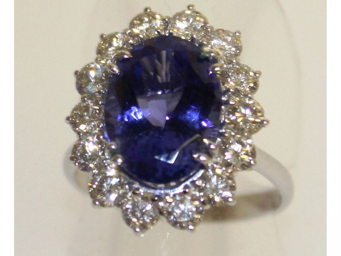 A superb large tanzanite, approx. 6cts, with diamond: A superb large tanzanite, approx. 6cts, with diamond surround, approx 2cts, set in 18ct white gold.