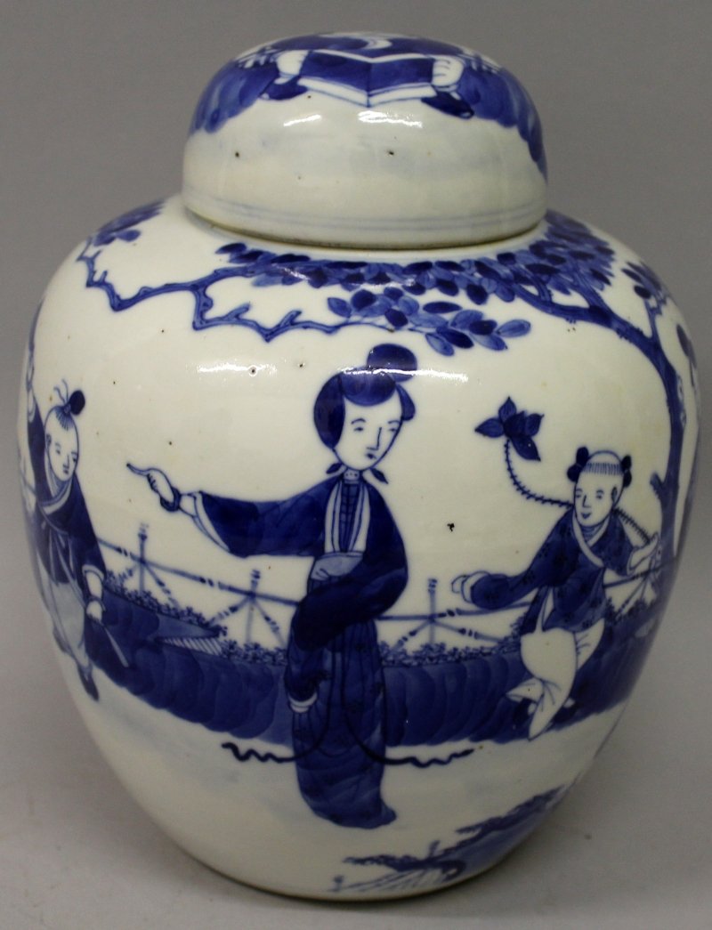 A 19TH CENTURY CHINESE BLUE & WHITE PORCELAIN JAR &: A 19TH CENTURY CHINESE BLUE & WHITE PORCELAIN JAR & COVER, the sides painted with a garden scene of ladies and boys, 6.6in wide at widest point & 8.25in high overall.