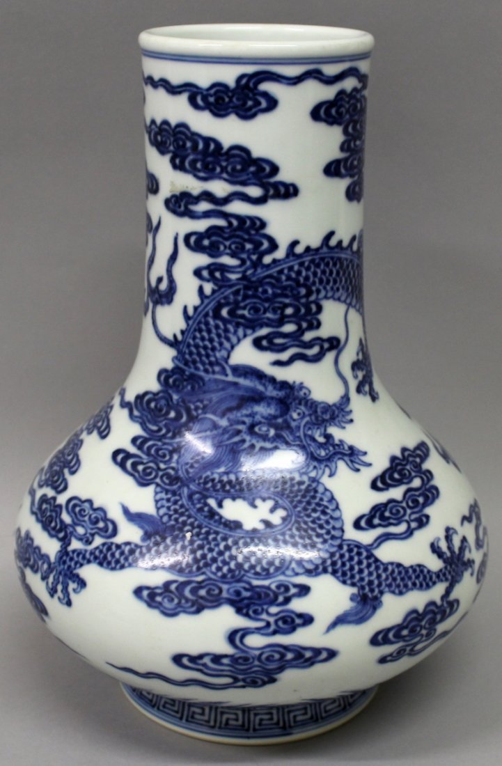 A CHINESE BLUE & WHITE PORCELAIN DRAGON BOTTLE VASE, (1 of 8)