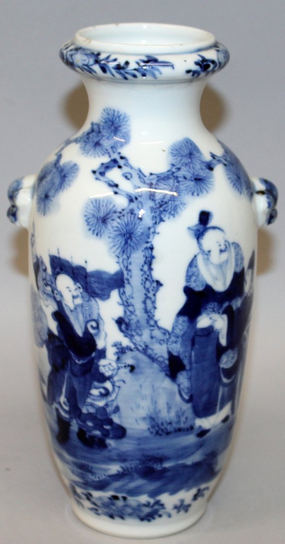 A 19TH CENTURY CHINESE BLUE & WHITE PORCELAIN VASE,: A 19TH CENTURY CHINESE BLUE & WHITE PORCELAIN VASE, with moulded buddhistic lion-head handles, the sides painted with a figural garden scene, the base with a four-character Kangxi mark, 8.2in high.