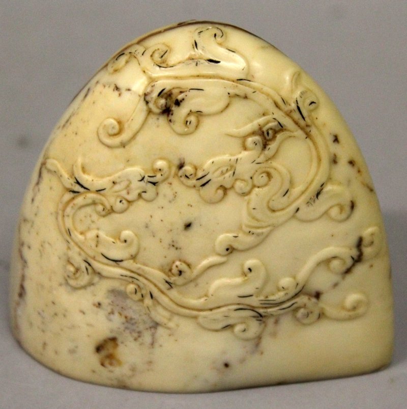 A CHINESE BOULDER FORM SOAPSTONE SEAL, the side (1 of 4)