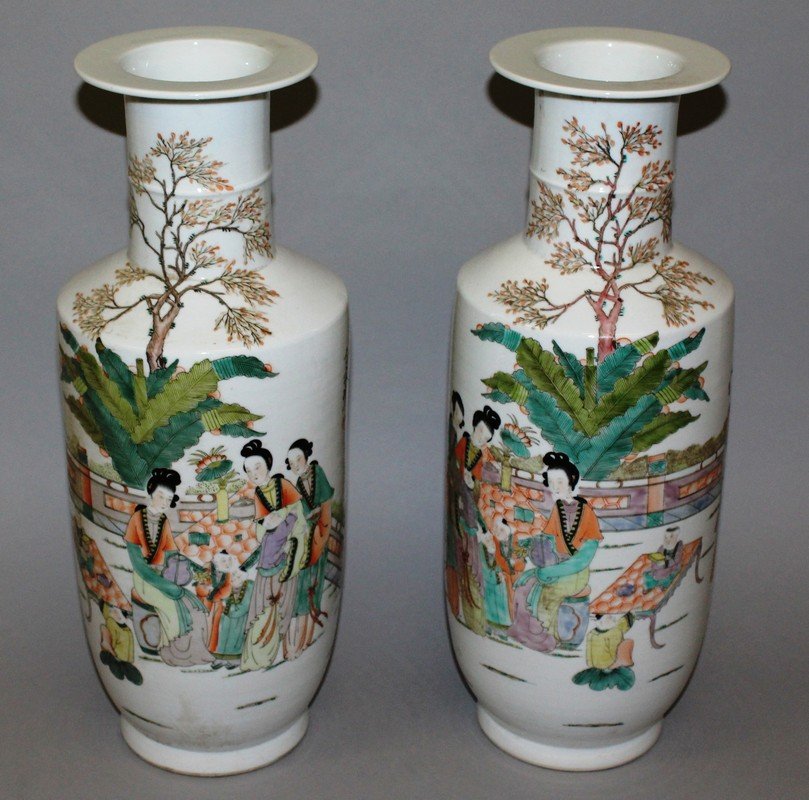 A PAIR OF PORCELAIN VASES painted with figures and: A PAIR OF PORCELAIN VASES painted with figures and calligraphy. 16ins high.