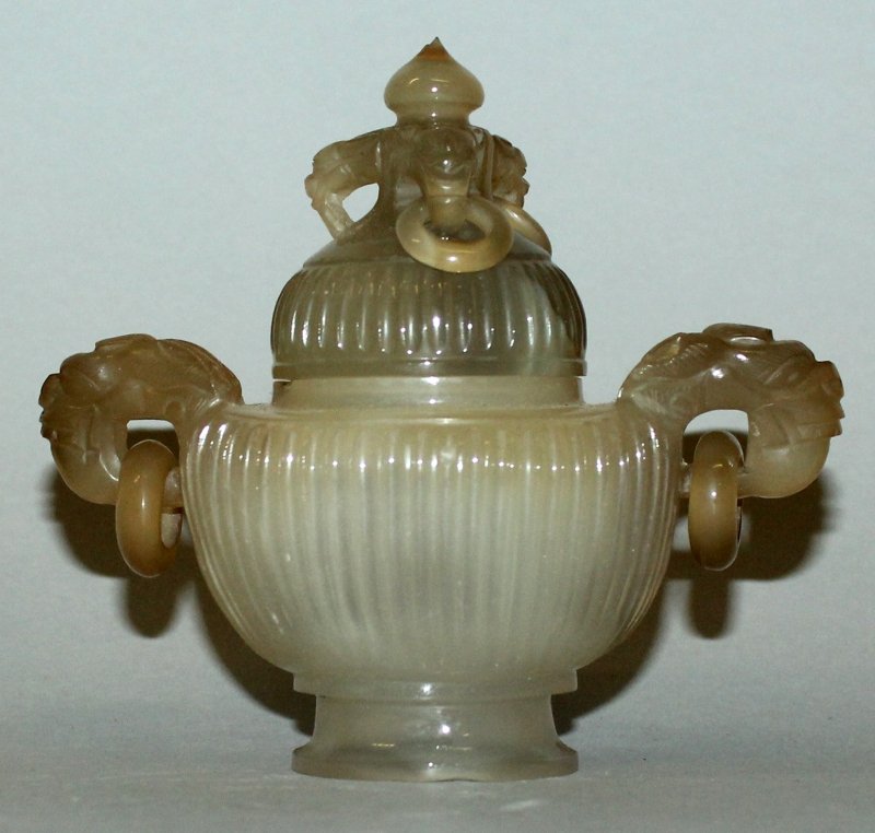 AN EARLY 20TH CENTURY CHINESE AGATE CENSER & COVER,: AN EARLY 20TH CENTURY CHINESE AGATE CENSER & COVER, with fluted sides and loose ring handles, 4.75in wide including handles & 4.3in high overall.