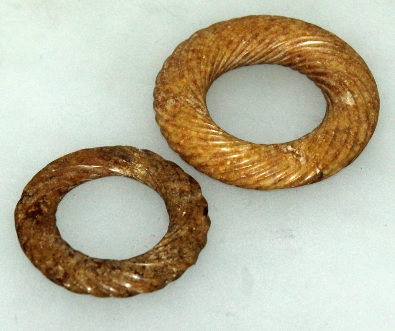 TWO CHINESE JADE BI DISCS, each with spiral decoration, (1 of 6)