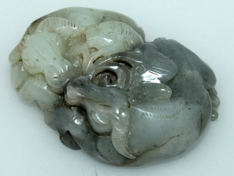 A CHINESE JADE MODEL OF TWIN RAMS, one animal of (1 of 5)