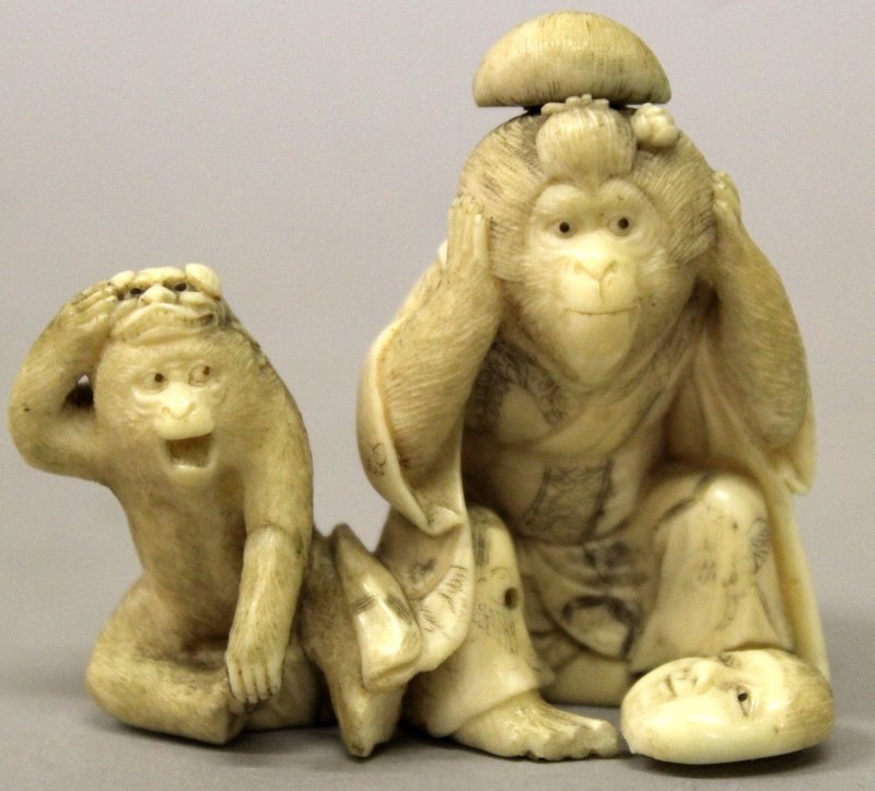 A JAPANESE MEIJI PERIOD IVORY OKIMONO OF TWO SEATED (1 of 7)