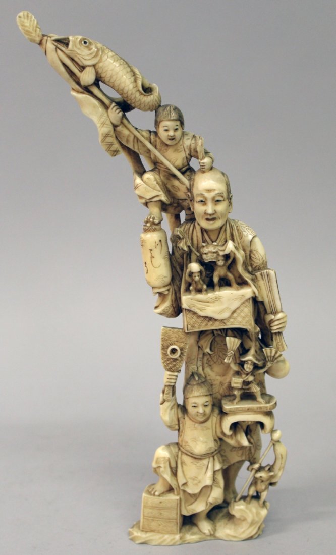 A GOOD JAPANESE MEIJI PERIOD IVORY OKIMONO OF A STREET (1 of 7)