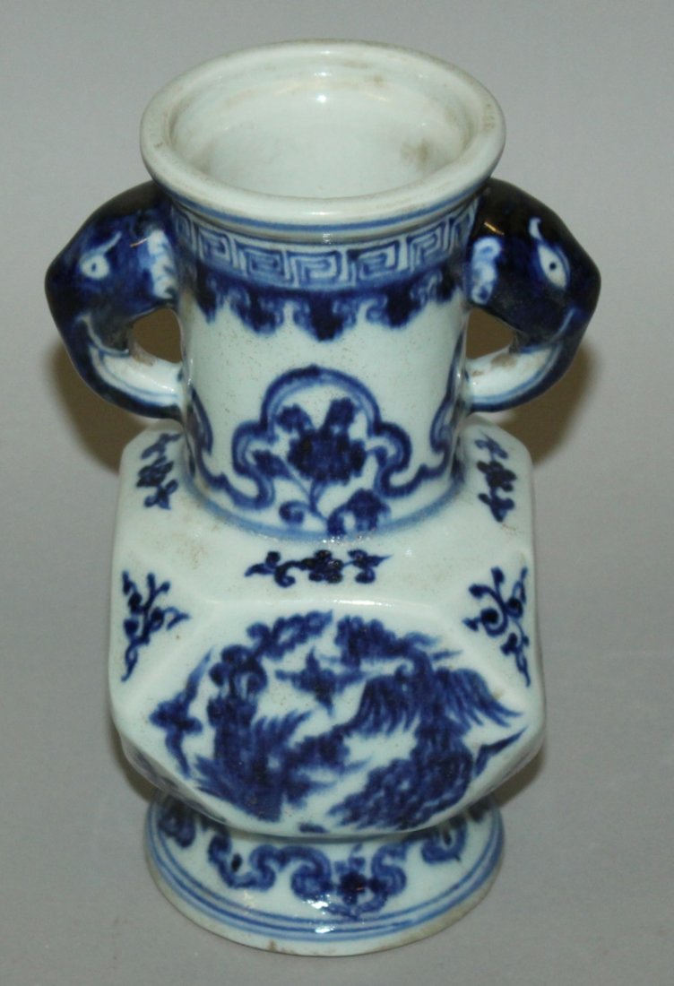 A CHINESE MING STYLE BLUE & WHITE PORCELAIN VASE, the: A CHINESE MING STYLE BLUE & WHITE PORCELAIN VASE, the facetted body decorated with double phoenix, the base with a six-character Xuande mark, 7.2in high.