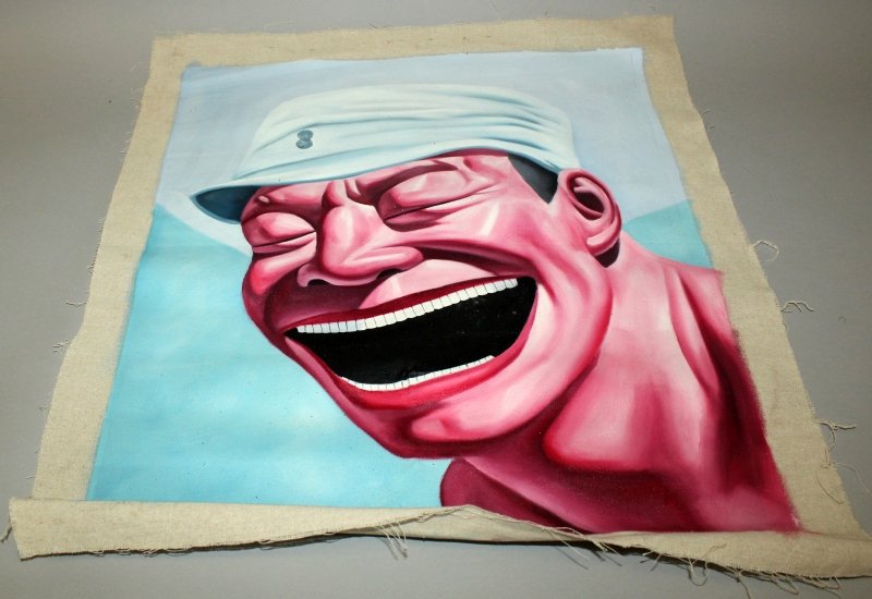 A CHINESE PAINTING ON FABRIC OF THE FACE OF A LAUGHING (1 of 1)