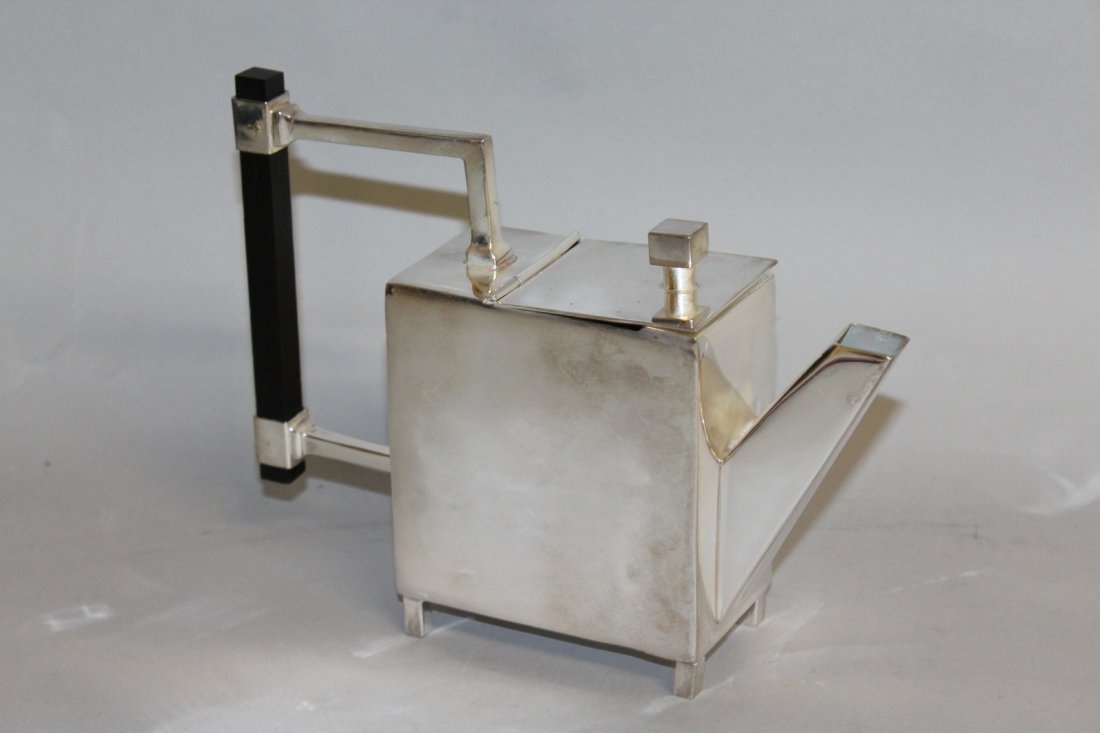 901. A CHRISTOPHER DRESSER DESIGN TEAPOT with wooden: 901. A CHRISTOPHER DRESSER DESIGN TEAPOT with wooden handle.