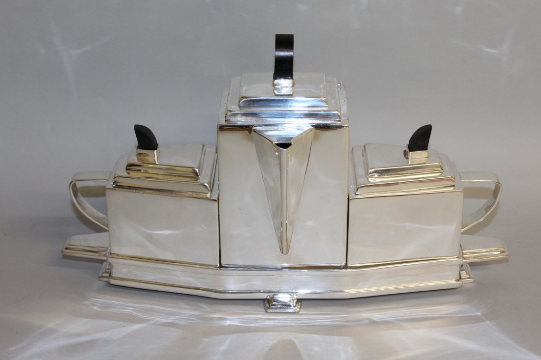 903. A CHRISTOPHER DRESSER DESIGN TEAPOT SET. 16ins: 903. A CHRISTOPHER DRESSER DESIGN TEAPOT SET. 16ins wide.