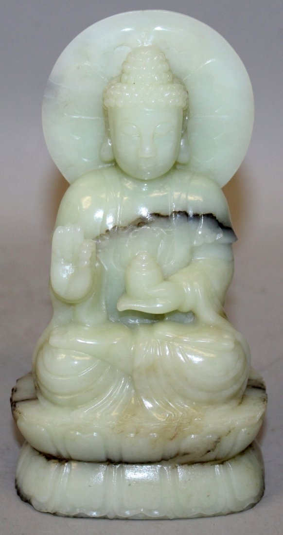 A 20TH CENTURY CHINESE CELADON JADE FIGURE OF BUDDHA, (1 of 8)