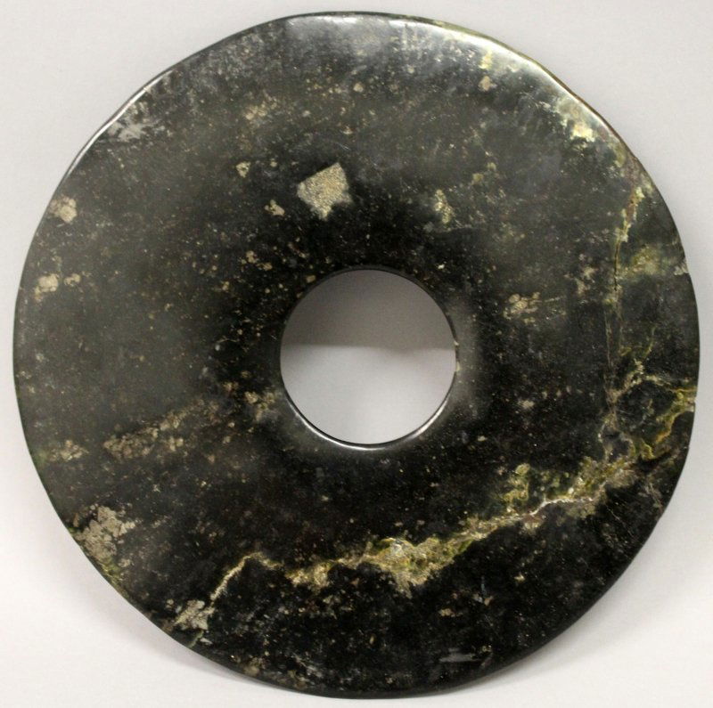 A LARGE CHINESE NEOLITHIC PERIOD JADE BI DISC, the (1 of 2)