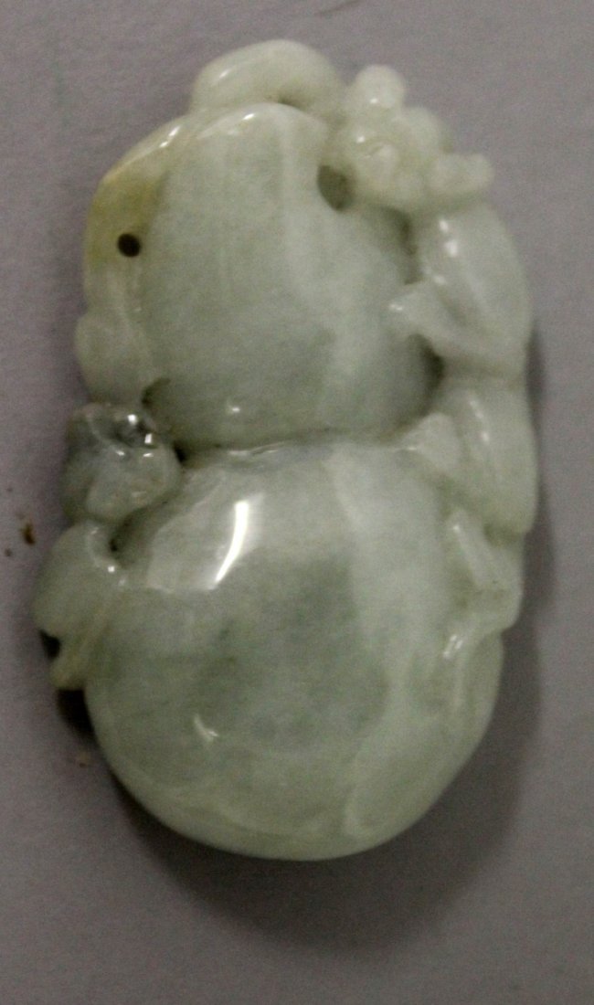 A SMALL CHINESE CELADON GREEN JADE PENDANT, in the form (1 of 3)