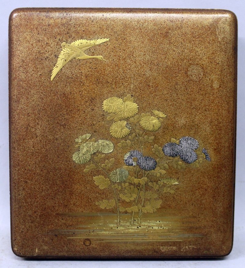 A FINE QUALITY JAPANESE EDO/MEIJI PERIOD LACQUER: A FINE QUALITY JAPANESE EDO/MEIJI PERIOD LACQUER SUZURIBAKO, the cover finely decorated with silver leaf and various gold lacquer techniques with a wild goose in flight above flowering chrysanthemum, 