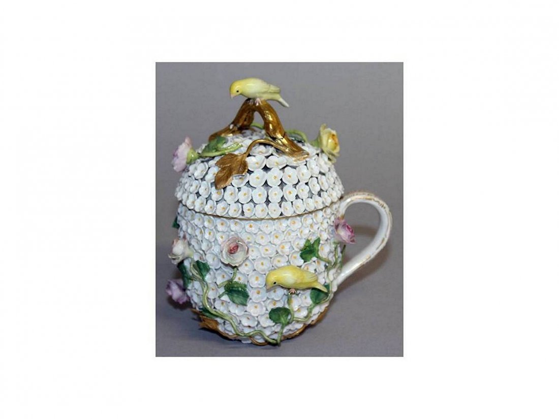 A MEISSEN SNOWBALL CUP AND COVER encrusted with flowers: A MEISSEN SNOWBALL CUP AND COVER encrusted with flowers and birds. Cross swords mark in blue.