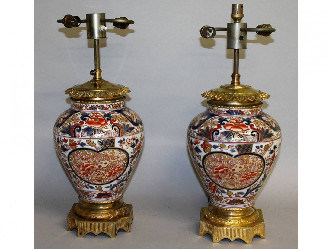 A SUPERB PAIR OF 19TH CENTURY SAMSON OF PARIS IMARI: A SUPERB PAIR OF 19TH CENTURY SAMSON OF PARIS IMARI PORCELAIN LAMPS with rich ormolu mounts. 13ins high excluding electrical fittings.