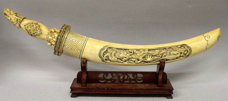 AN EARLY 20TH CENTURY CHINESE IVORY SHORT SWORD, with (1 of 10)