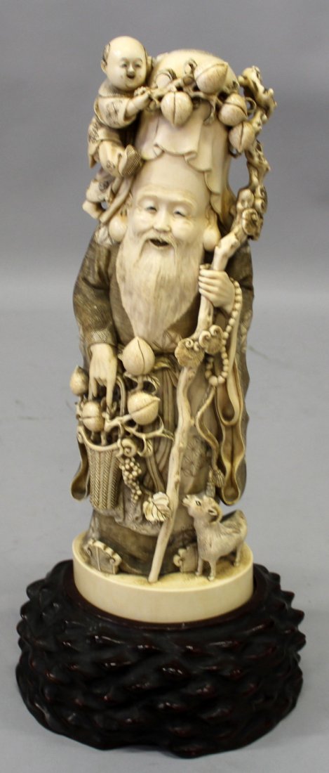 A LARGE FINE QUALITY JAPANESE MEIJI PERIOD IVORY: A LARGE FINE QUALITY JAPANESE MEIJI PERIOD IVORY OKIMONO OF FUKUROKUJU BY SEIZAN, together with a fitted wood stand, the single piece ivory weighing 3.14Kg, the ivory finely carved and pierced, the de