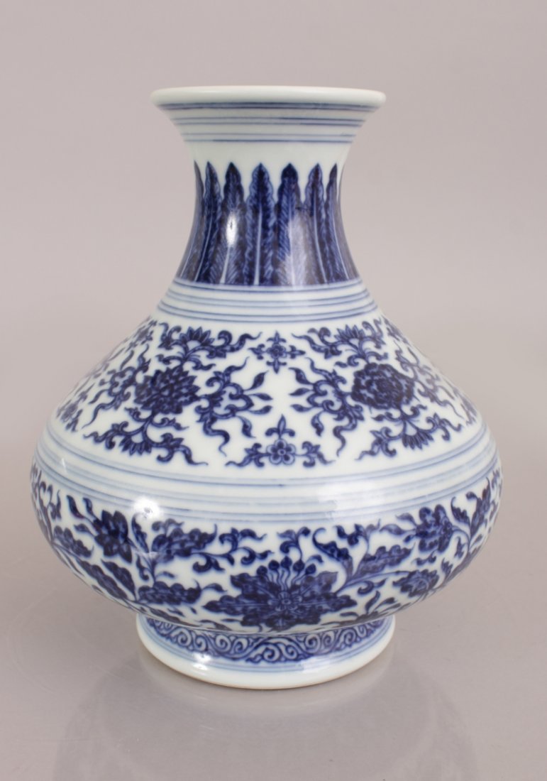 A GOOD QUALITY CHINESE MING STYLE BLUE & WHITE: A GOOD QUALITY CHINESE MING STYLE BLUE & WHITE PORCELAIN VASE, the sides of the bulbous body decorated with bands of formal foliage, the base with a six-character Yongzheng mark, 8in high.