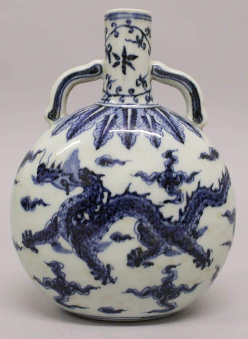 A CHINESE MING STYLE BLUE & WHITE PORCELAIN DRAGON (1 of 3)