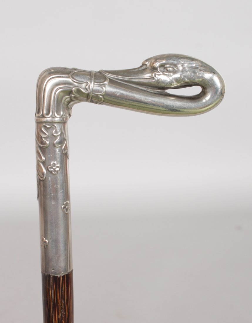 A SILVER TOPPED "SWAN" AND PARTRIDGE WOOD CANE. Date:: A SILVER TOPPED "SWAN" AND PARTRIDGE WOOD CANE. Date: 1900. Country: English. A well modelled late Victorian silver swan. This is a superb English cane. The silver work is of outstanding quality and c