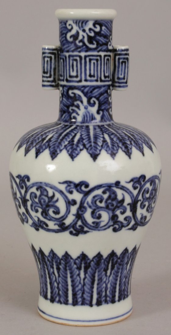 A CHINESE MING STYLE BLUE & WHITE PORCELAIN ARROW VASE,: A CHINESE MING STYLE BLUE & WHITE PORCELAIN ARROW VASE, the sides decorated with formal foliate borders and designs, the neck with waves and key-fret, the base with a six-character Xuande mark, 7.7in 