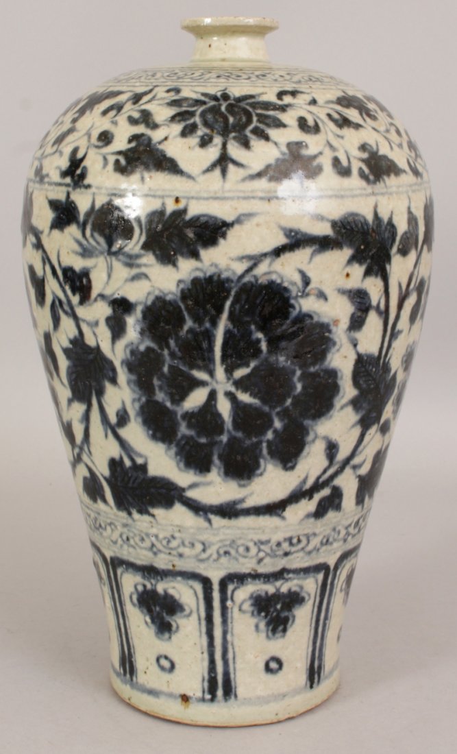 A CHINESE YUAN STYLE BLUE & WHITE MEIPING PORCELAIN: A CHINESE YUAN STYLE BLUE & WHITE MEIPING PORCELAIN VASE, the sides decorated with formal floral designs, the base unglazed, 12.4in high.