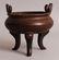 A CHINESE CIRCULAR SECTION TRIPOD BRONZE CENSER,