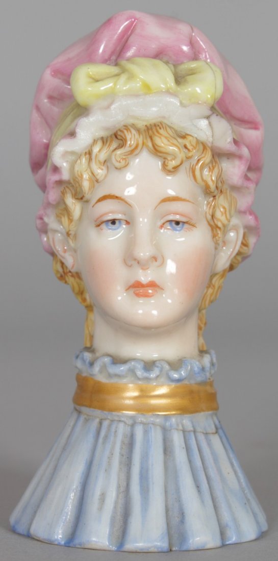 A ROYAL WORCESTER CANDLE SNUFFER (with crack). 3.25: A ROYAL WORCESTER CANDLE SNUFFER (with crack). 3.25 ins high.