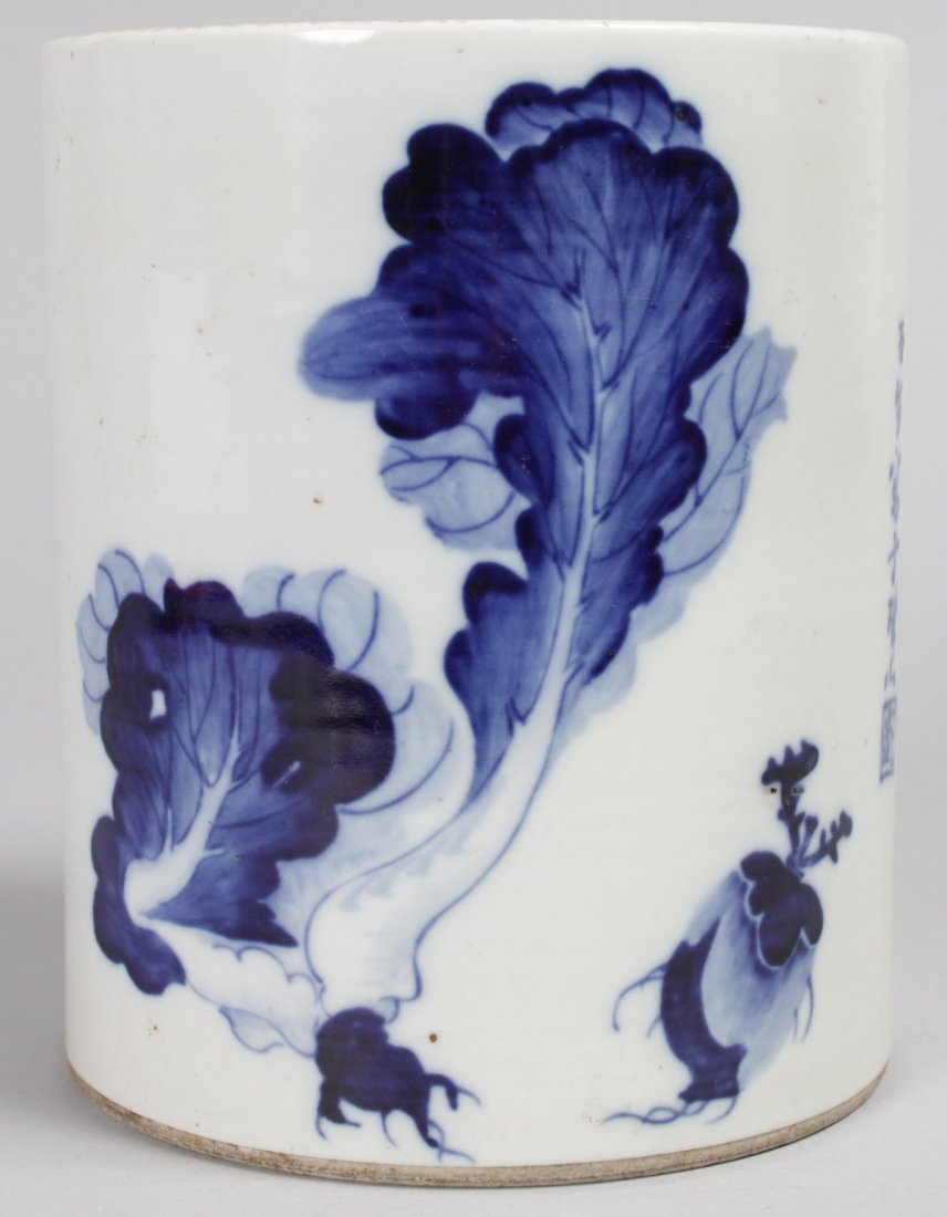 A CHINESE BLUE AND WHITE CIRCULAR BRUSH POT with: A CHINESE BLUE AND WHITE CIRCULAR BRUSH POT with calligraphy. 6ins high.