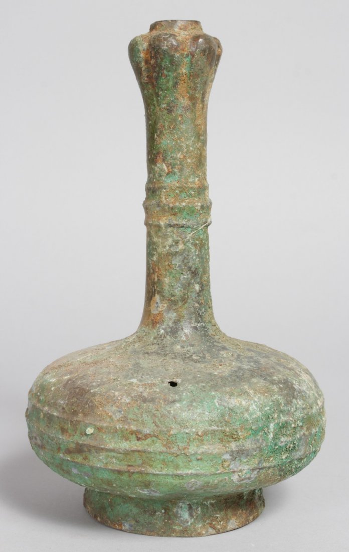AN EARLY METAL BULBOUS BOTTLE. 10.5ins high.: AN EARLY METAL BULBOUS BOTTLE. 10.5ins high.