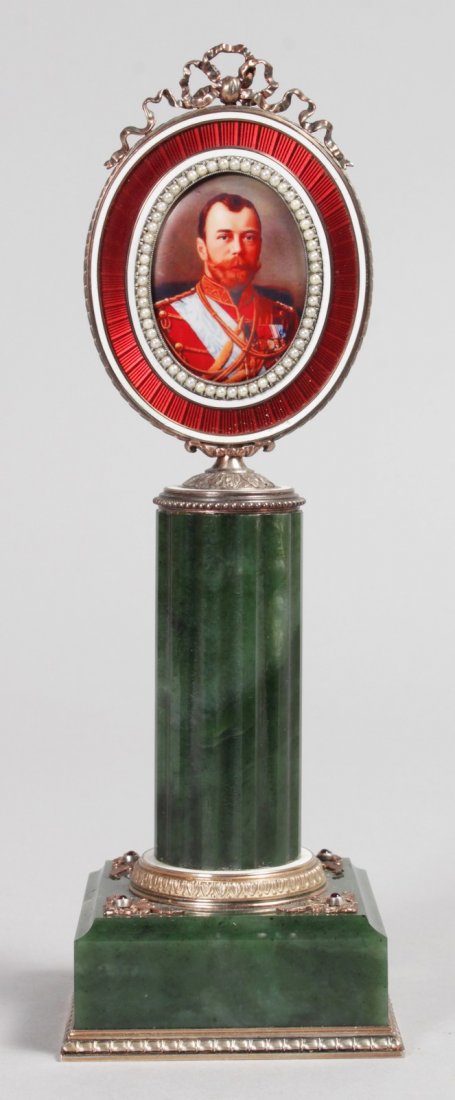 A SUPERB "FABERGE" JADE, ENAMEL AND SEED PEARL PORTRAIT: A SUPERB "FABERGE" JADE, ENAMEL AND SEED PEARL PORTRAIT MINIATURE OF NICHOLAS II, on a column with square base. 7.5ins high overall.