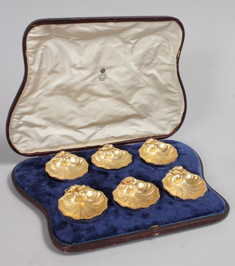 A SET OF SIX FABERGE SILVER GILT SHELL SALTS, mounted: A SET OF SIX FABERGE SILVER GILT SHELL SALTS, mounted with rats. Stamped 88 with head. Makers mark AV. In a fitted leather case.