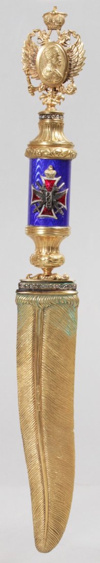 A SUPERB "FABERGE" SILVER AND ENAMEL FEATHER DESIGN: A SUPERB "FABERGE" SILVER AND ENAMEL FEATHER DESIGN LETTER OPENER with diamonds and blue enamel. 10ins long.