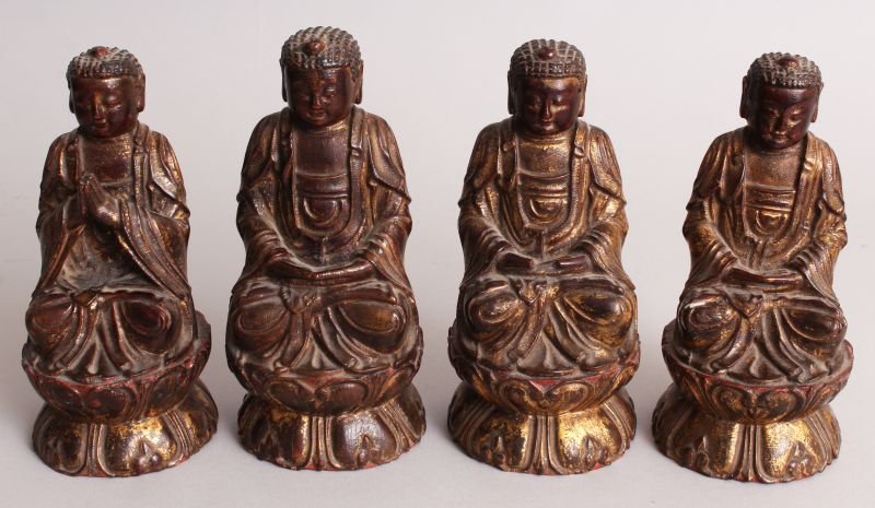 FOUR 19TH CENTURY CHINESE LACQUERED AND GILDED WOOD: FOUR 19TH CENTURY CHINESE LACQUERED AND GILDED WOOD FIGURES OF BUDDHA, in meditative and prayerful attitudes, the tallest 6.9in high. (4)