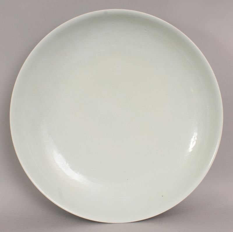 A LARGE CHINESE PALE CELADON PORCELAIN DISH, of saucer (1 of 4)