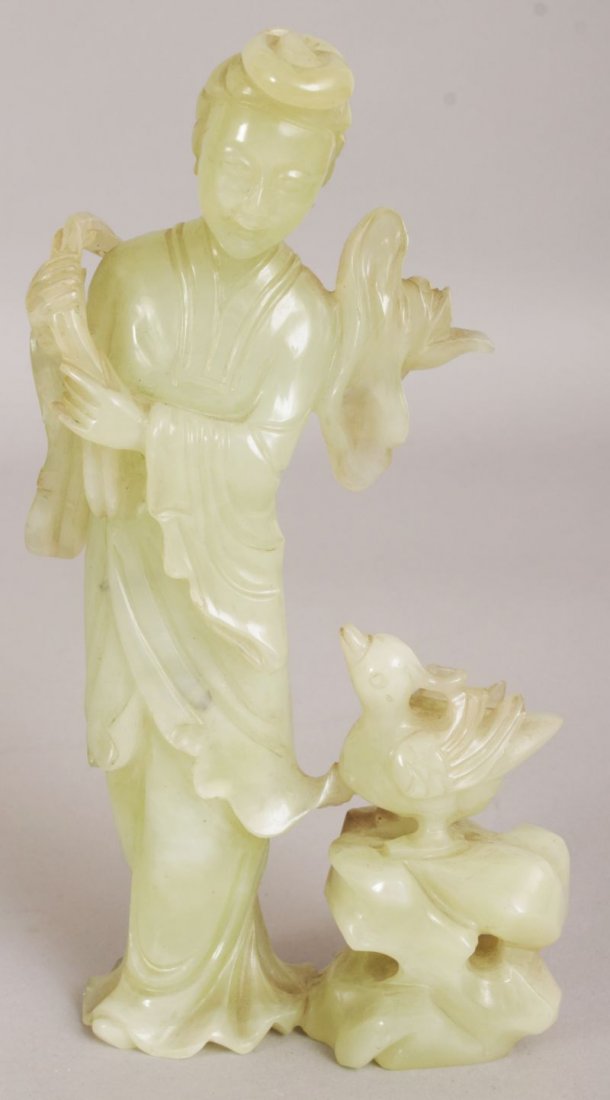 A 20TH CENTURY CHINESE CELADON GREEN BOWENITE FIGURE OF (1 of 4)
