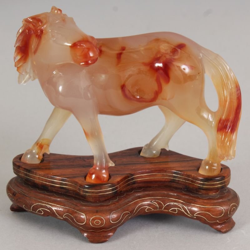 A CHINESE AGATE MODEL OF A STANDING HORSE, its head (1 of 4)