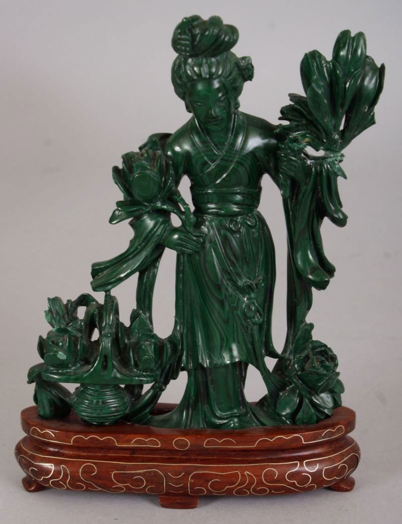 A CHINESE MALACHITE FIGURE OF GUANYIN, together with a (1 of 6)
