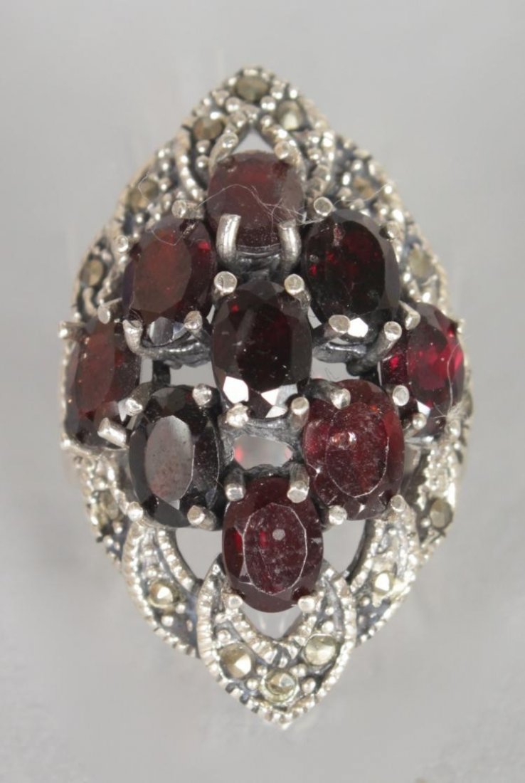A LARGE RUBY AND MARCASITE DRESS RING.: A LARGE RUBY AND MARCASITE DRESS RING.